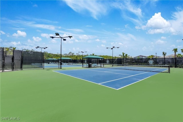 view of sport court with fence
