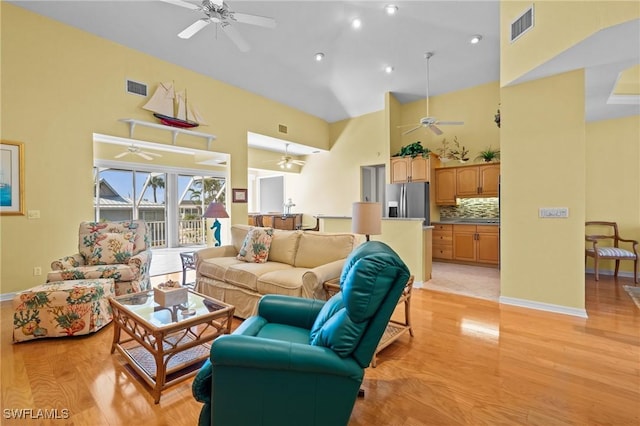 21075 Saint Peters Dr S, Fort Myers Beach, FL 33931 - living area with high vaulted ceiling, a ceiling fan, light wood-style flooring, baseboards, and recessed lighting