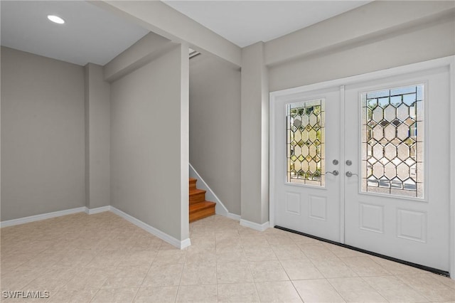 21075 Saint Peters Dr S, Fort Myers Beach, FL 33931 - entryway featuring french doors, stairway, baseboards, recessed lighting, and light tile patterned floors
