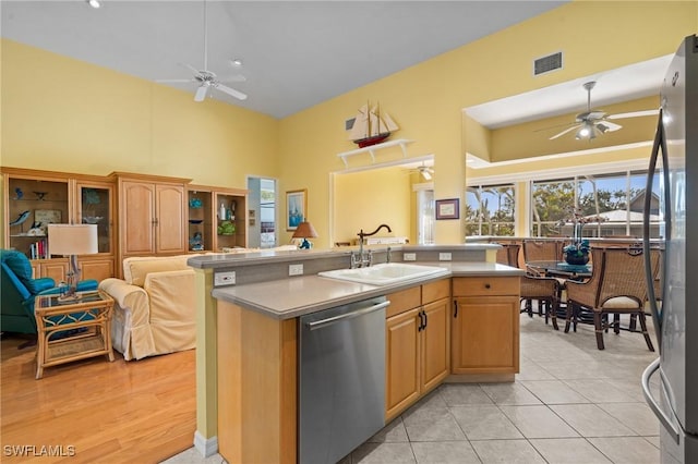 21075 Saint Peters Dr S, Fort Myers Beach, FL 33931 - kitchen with appliances with stainless steel finishes, ceiling fan, a sink, high vaulted ceiling, and open floor plan