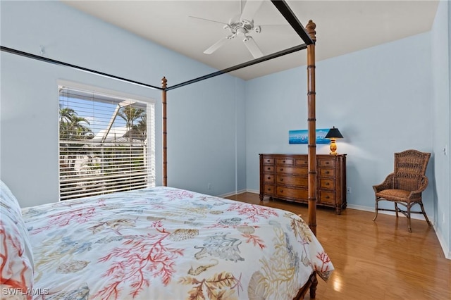 21075 Saint Peters Dr S, Fort Myers Beach, FL 33931 - bedroom featuring wood finished floors, baseboards, and a ceiling fan