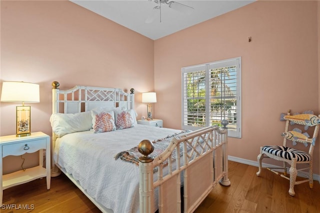 21075 Saint Peters Dr S, Fort Myers Beach, FL 33931 - bedroom featuring wood finished floors, baseboards, and ceiling fan