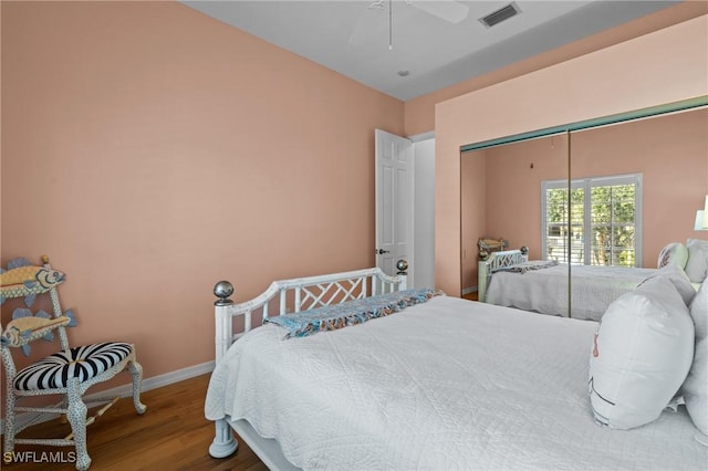 21075 Saint Peters Dr S, Fort Myers Beach, FL 33931 - bedroom with wood finished floors, a closet, baseboards, and a ceiling fan