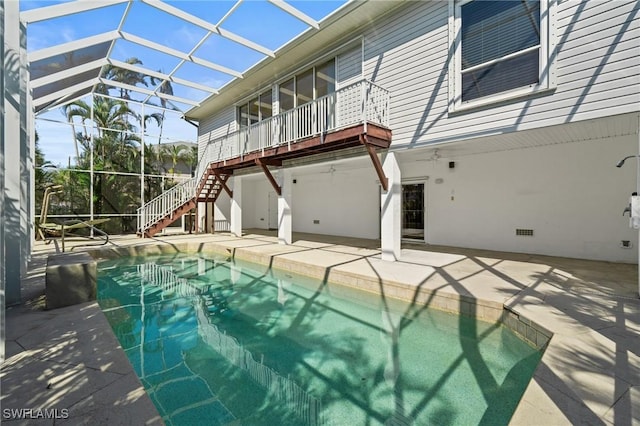 21075 Saint Peters Dr S, Fort Myers Beach, FL 33931 - swimming pool featuring stairway, a patio, and a lanai