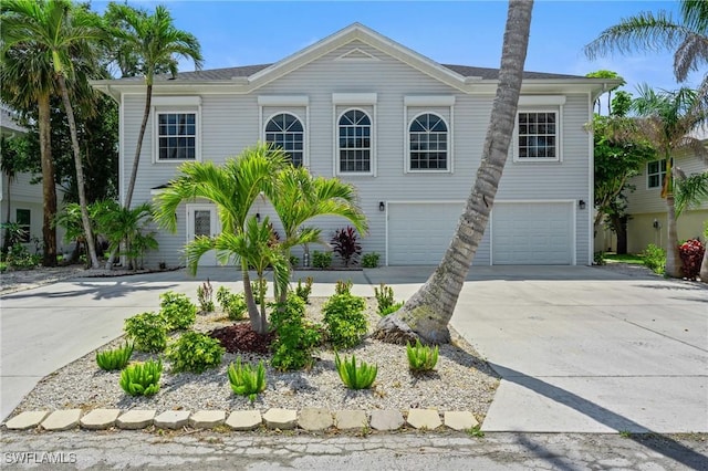 21075 Saint Peters Dr S, Fort Myers Beach, FL 33931 - view of front facade with driveway and a garage