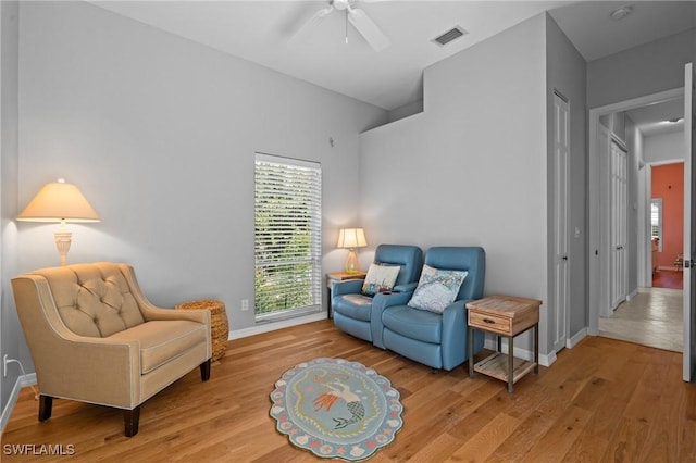 21075 Saint Peters Dr S, Fort Myers Beach, FL 33931 - sitting room with wood finished floors, ceiling fan, plenty of natural light, and baseboards