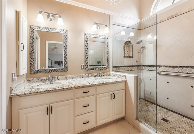 522 Countryside Dr, Naples, FL 34104 - bathroom with a shower stall, tile patterned flooring, a sink, and double vanity