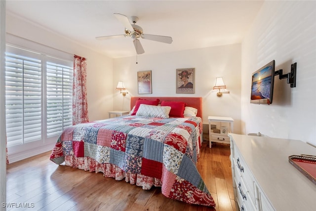 522 Countryside Dr, Naples, FL 34104 - bedroom with light wood-type flooring and a ceiling fan