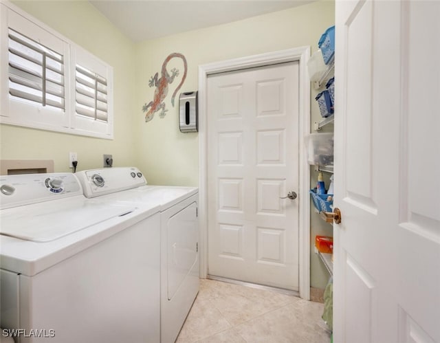 522 Countryside Dr, Naples, FL 34104 - laundry area with independent washer and dryer, light tile patterned floors, and laundry area
