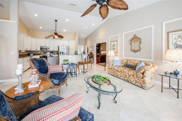 522 Countryside Dr, Naples, FL 34104 - living room with light tile patterned flooring, vaulted ceiling, visible vents, and ceiling fan