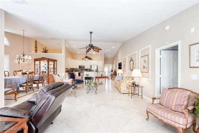 522 Countryside Dr, Naples, FL 34104 - living room with high vaulted ceiling, baseboards, and ceiling fan with notable chandelier