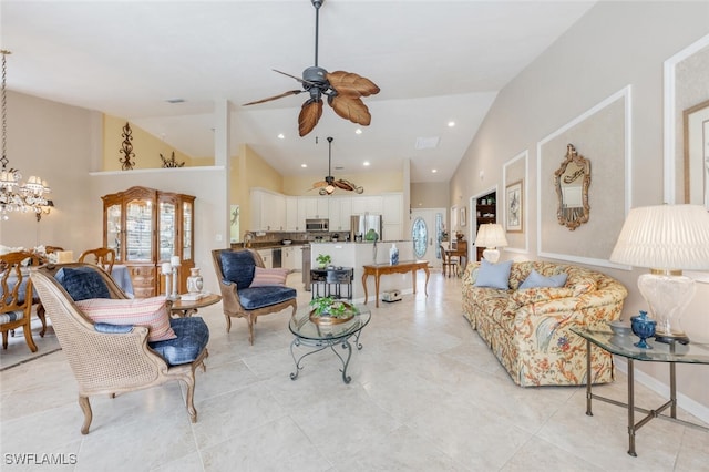 522 Countryside Dr, Naples, FL 34104 - living room with high vaulted ceiling, light tile patterned floors, recessed lighting, and ceiling fan with notable chandelier
