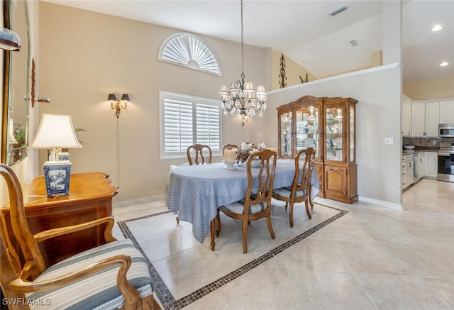 522 Countryside Dr, Naples, FL 34104 - dining space with high vaulted ceiling, a notable chandelier, visible vents, and light tile patterned floors