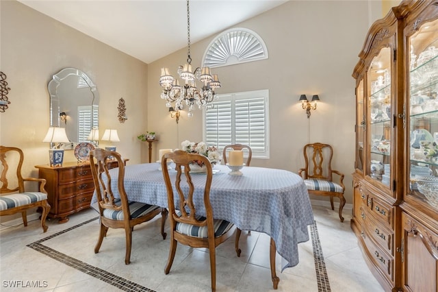 522 Countryside Dr, Naples, FL 34104 - dining space featuring an inviting chandelier, light tile patterned floors, and high vaulted ceiling