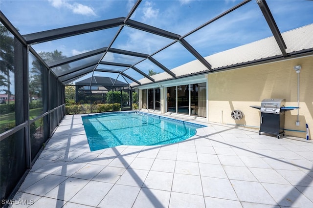 522 Countryside Dr, Naples, FL 34104 - outdoor pool with glass enclosure, a patio, and a grill