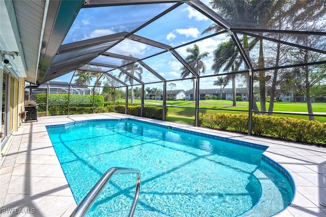 522 Countryside Dr, Naples, FL 34104 - outdoor pool with glass enclosure, a patio area, and area for grilling