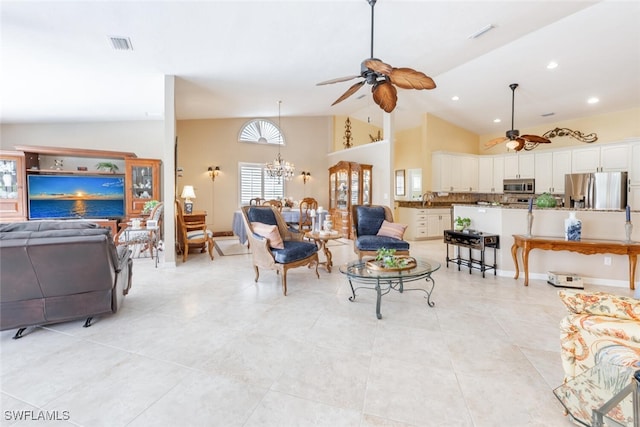 522 Countryside Dr, Naples, FL 34104 - living room with high vaulted ceiling, light tile patterned flooring, visible vents, and ceiling fan with notable chandelier