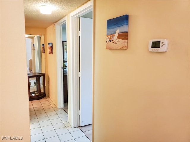 3706 Broadway Unit 5, Fort Myers, FL 33901 - hall with a textured ceiling and light tile patterned floors