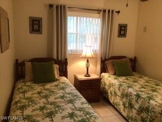 3706 Broadway Unit 5, Fort Myers, FL 33901 - bedroom featuring light tile patterned flooring
