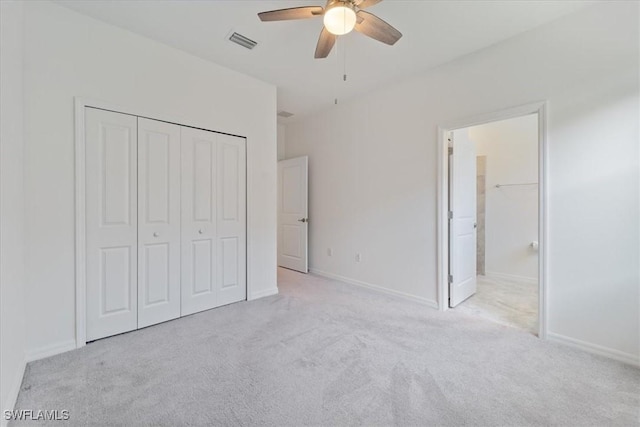 2161 Gardenia Ave, Port Charlotte, FL 33953 - unfurnished bedroom with baseboards, visible vents, carpet, a ceiling fan, and a closet