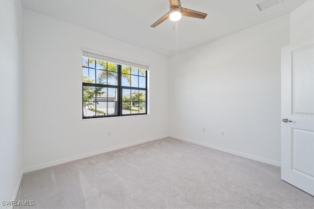 2161 Gardenia Ave, Port Charlotte, FL 33953 - carpeted empty room featuring a ceiling fan and baseboards