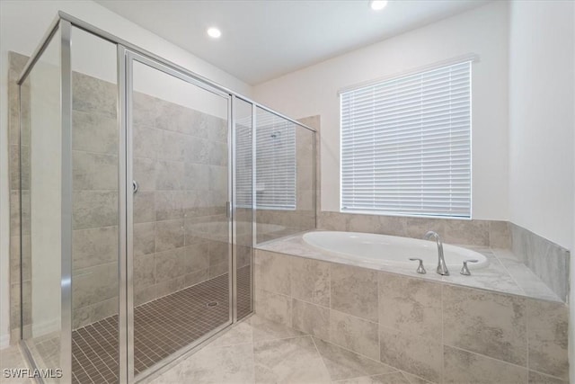 2161 Gardenia Ave, Port Charlotte, FL 33953 - full bath featuring a bath, recessed lighting, and a shower stall