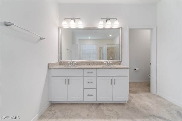 2161 Gardenia Ave, Port Charlotte, FL 33953 - bathroom featuring a sink, double vanity, toilet, baseboards, and a shower stall