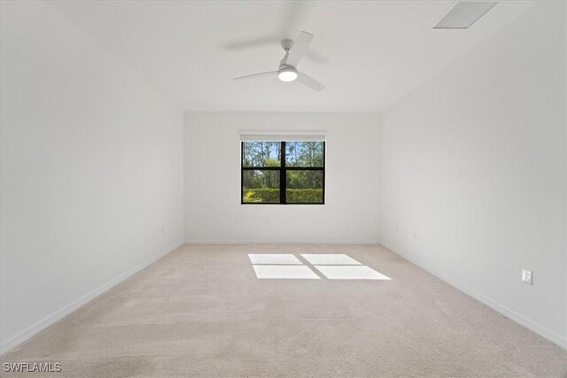 2161 Gardenia Ave, Port Charlotte, FL 33953 - empty room featuring light colored carpet, ceiling fan, baseboards, and visible vents