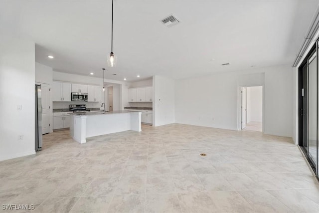 2161 Gardenia Ave, Port Charlotte, FL 33953 - unfurnished living room with a sink, visible vents, and recessed lighting