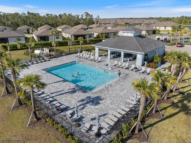 2161 Gardenia Ave, Port Charlotte, FL 33953 - pool with a residential view, a lawn, and fence