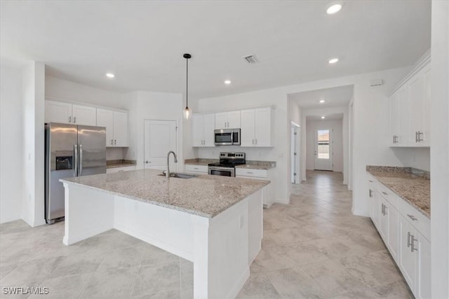 2161 Gardenia Ave, Port Charlotte, FL 33953 - kitchen with a sink, a center island with sink, visible vents, recessed lighting, and appliances with stainless steel finishes