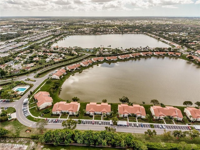 birds eye view of property featuring a residential view and a water view