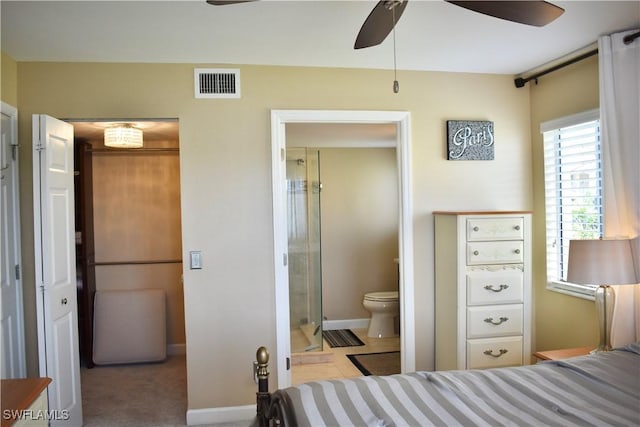 bedroom featuring connected bathroom, ceiling fan, baseboards, and visible vents