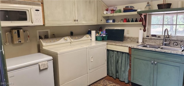 3105 Secretariat Dr, Labelle, FL 33935 - clothes washing area featuring separate washer and dryer, a sink, and laundry area