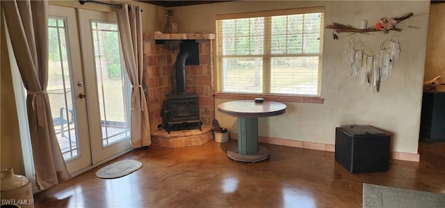 3105 Secretariat Dr, Labelle, FL 33935 - doorway with a wealth of natural light, french doors, finished concrete floors, and a wood stove
