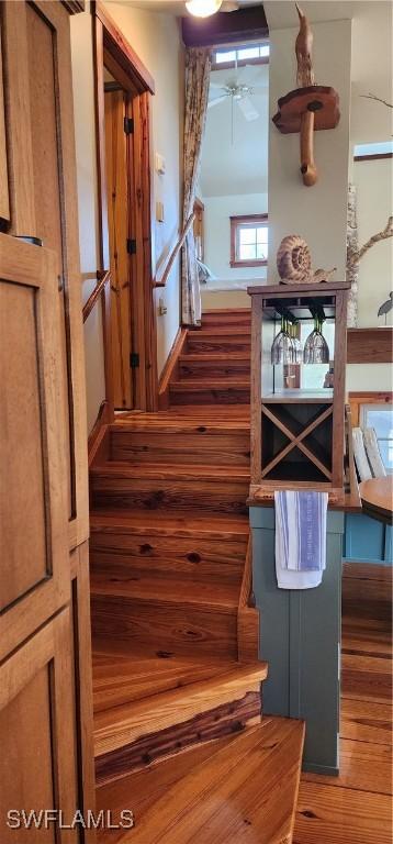 3105 Secretariat Dr, Labelle, FL 33935 - stairway featuring wood finished floors and a ceiling fan
