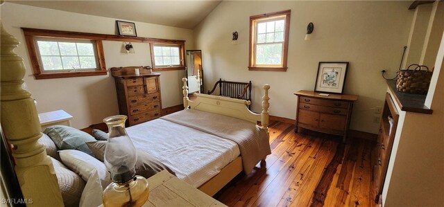 3105 Secretariat Dr, Labelle, FL 33935 - bedroom featuring baseboards, wood-type flooring, and lofted ceiling