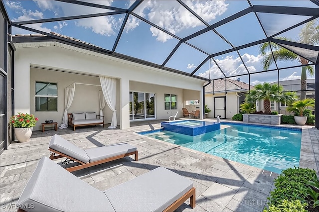 view of pool featuring a patio, glass enclosure, and a pool with connected hot tub