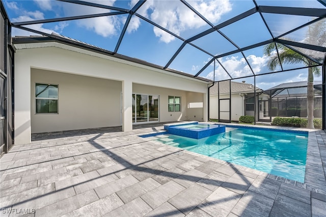 view of pool with a patio and a pool with connected hot tub