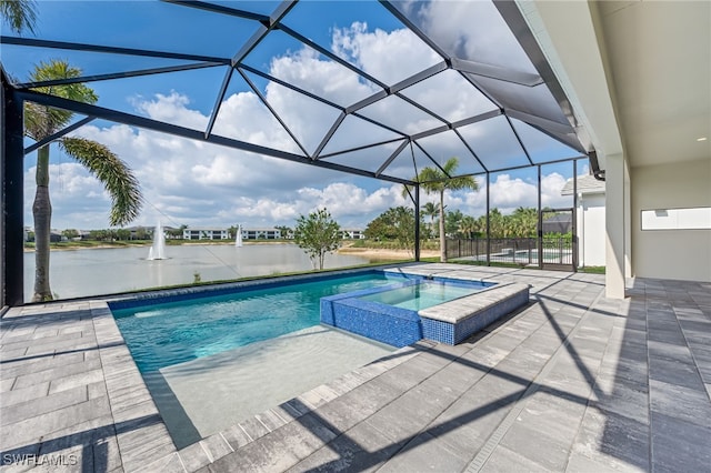 view of pool with a lanai, a water view, a patio, and a pool with connected hot tub
