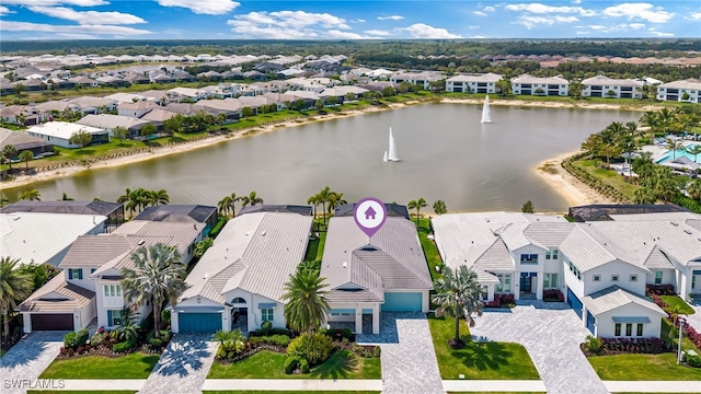 aerial view with a residential view and a water view