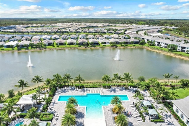 birds eye view of property with a residential view and a water view