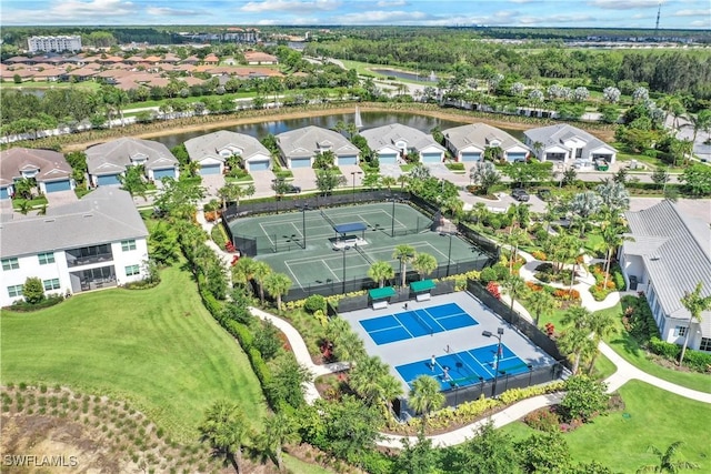 bird's eye view with a residential view and a water view