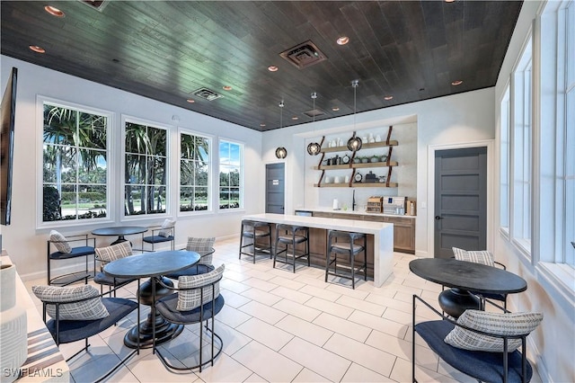 interior space featuring visible vents, light tile patterned floors, recessed lighting, and wood ceiling