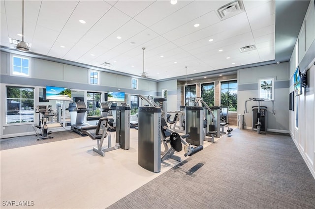 exercise room with visible vents, recessed lighting, and carpet floors