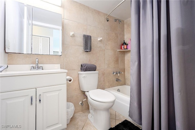 240 N Collier Blvd Unit G1, Marco Island, FL 34145 - bathroom with tile walls, tile patterned flooring, shower / bath combo with shower curtain, toilet, and vanity