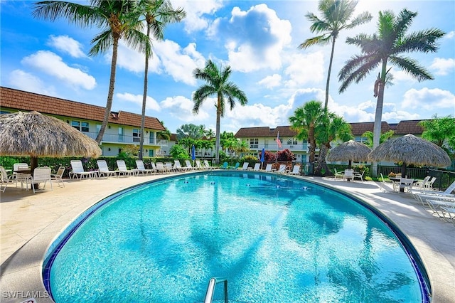 240 N Collier Blvd Unit G1, Marco Island, FL 34145 - community pool featuring a patio area, fence, and a residential view