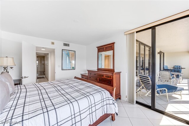bedroom with light tile patterned floors, access to outside, and visible vents