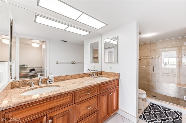 full bathroom with a sink, tile patterned flooring, toilet, and a stall shower