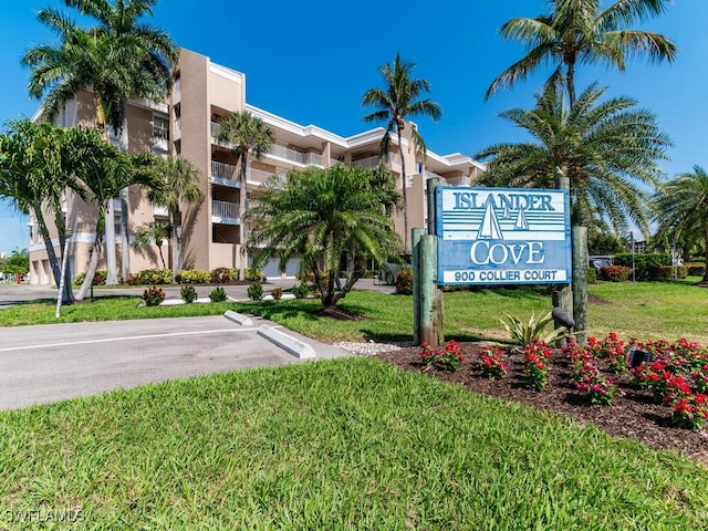 900 Collier Ct Unit 106, Marco Island, FL 34145 - community sign featuring uncovered parking and a yard